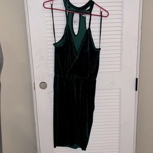 Rich green velvet cross body top and skirt.